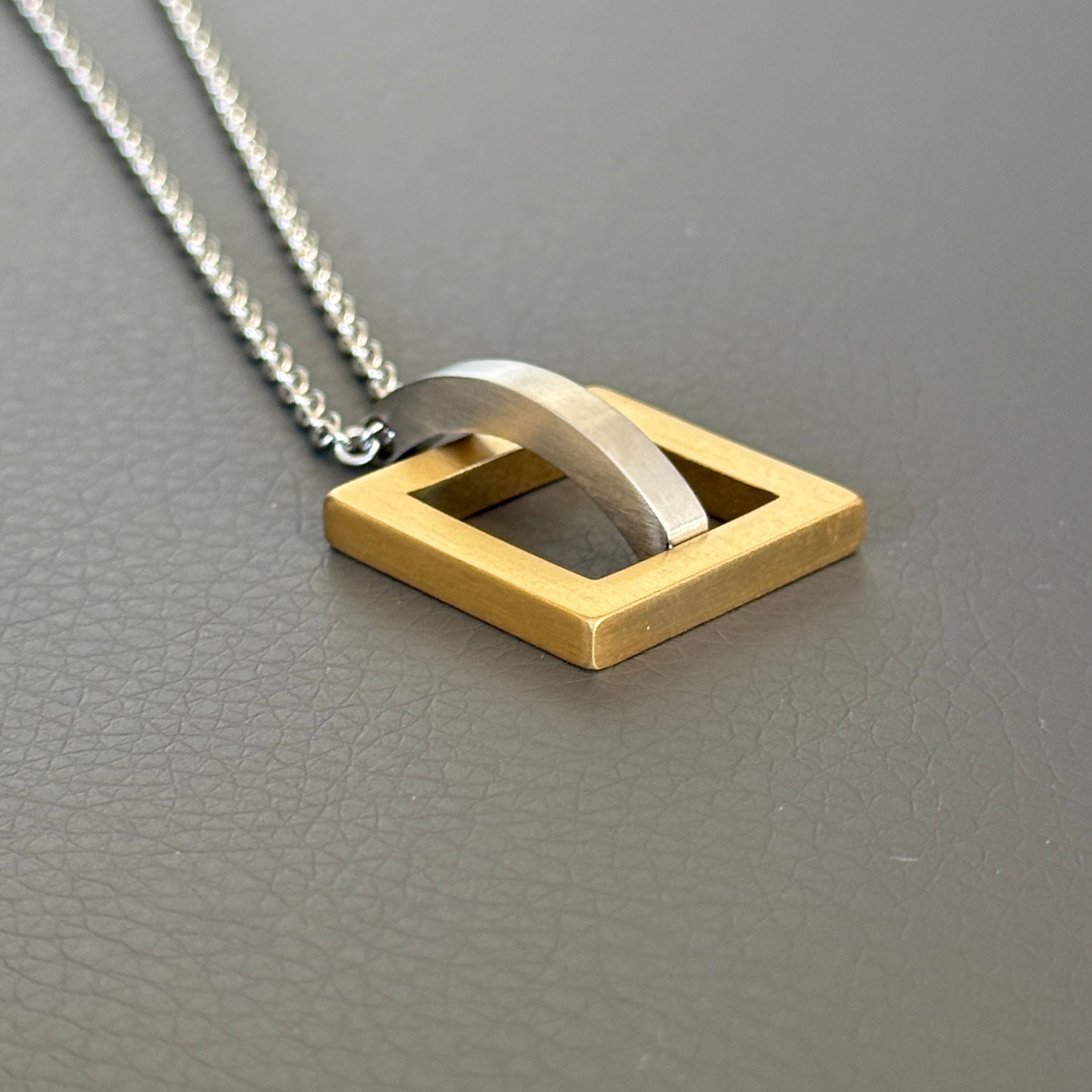 Gold Square with Silver Arc Geometric Pendant