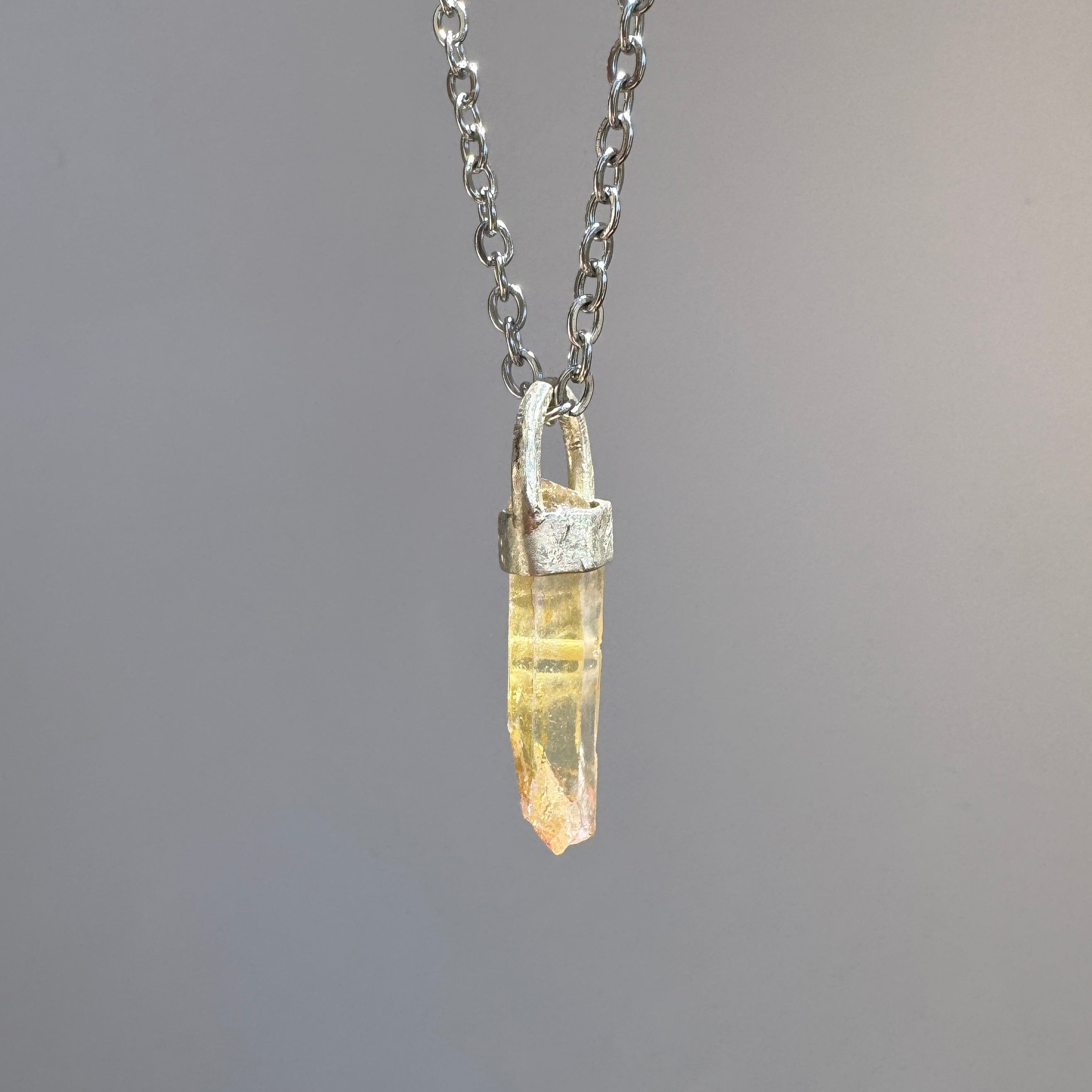 Natural rough stone quartz pendant on sterling silver base