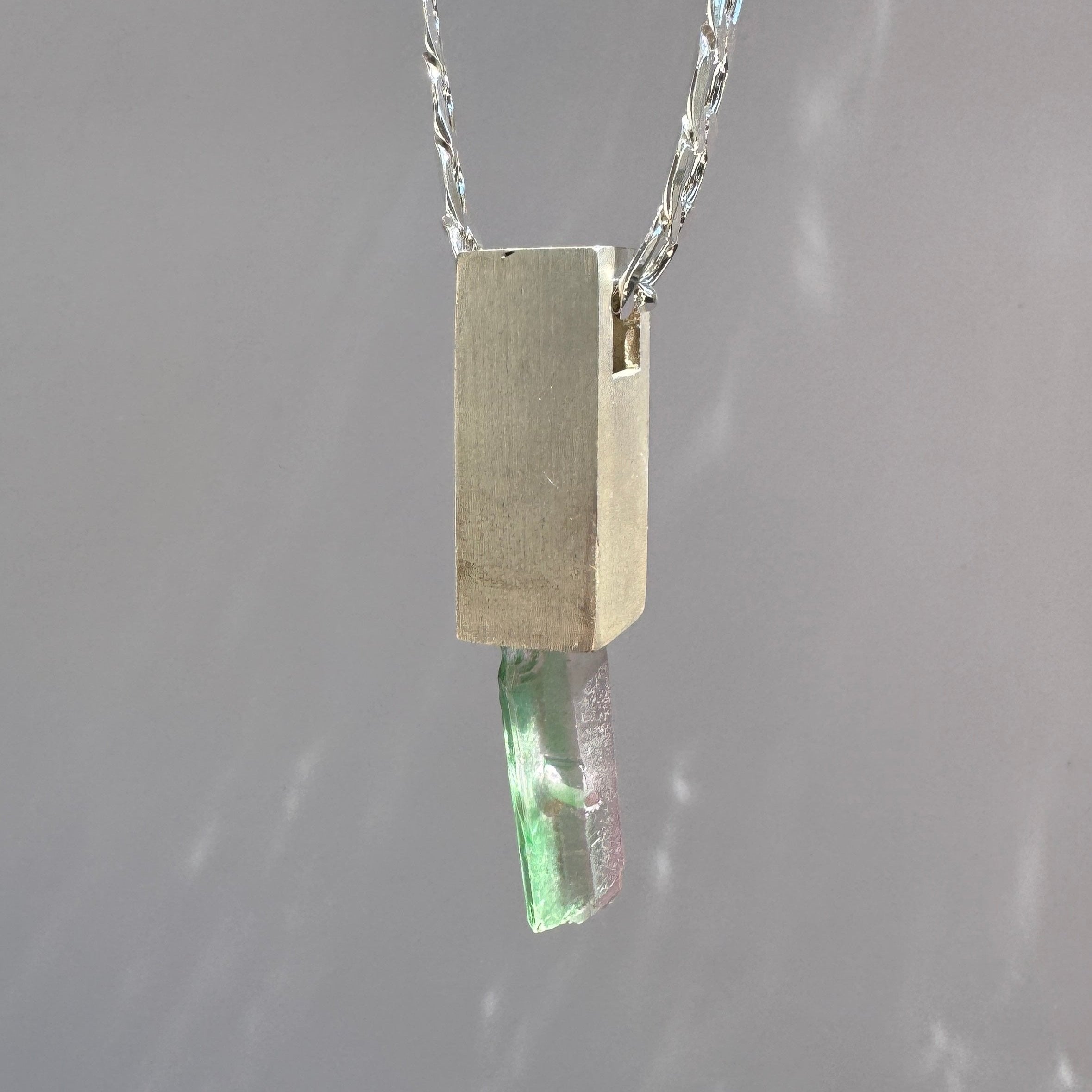 Raw aquamarine stone pendant necklace on sterling silver base